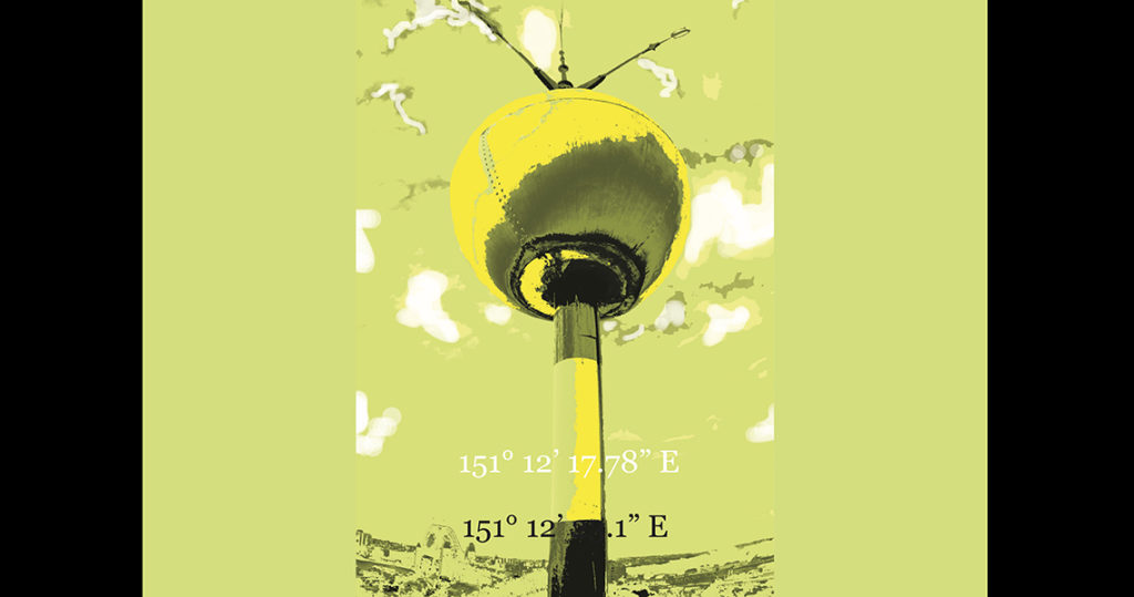 Metal yellow ball on a pole against a yellow background.
